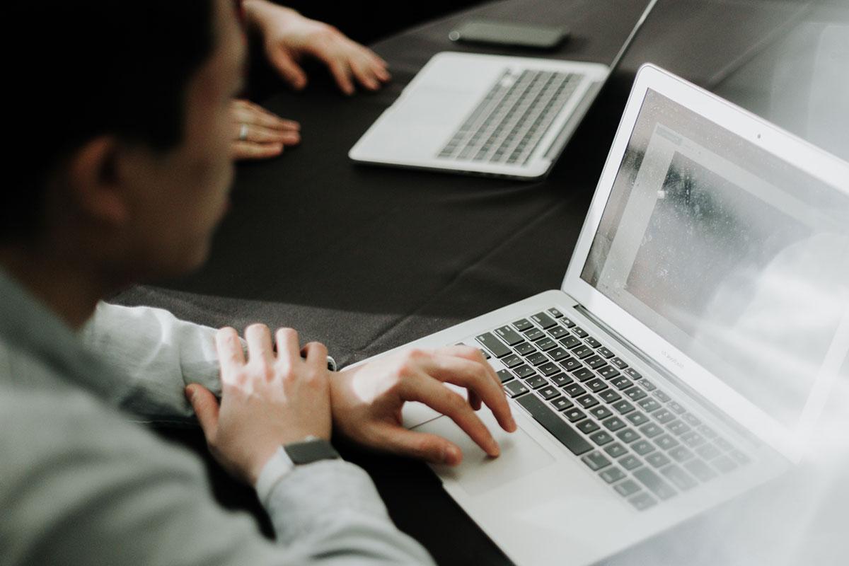 a gaming and interactive design major works on a laptop